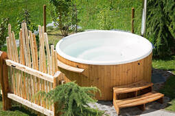Picture of a hottub in a back yard.